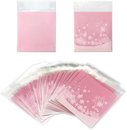 100 PCS Snowflake Cellophane Bags - Clear Self Sealing Pink Plastic Bags for Candy, Cookies & Goodies
